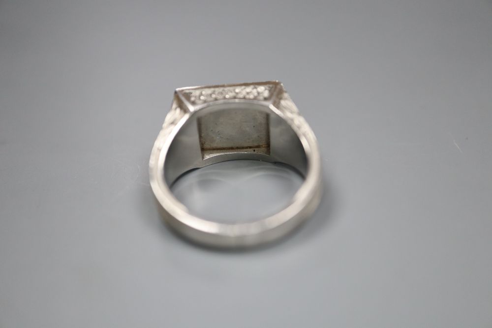 A mid to late 20th century French white metal (post 1927 French platinum mark) and coloured paste set ring, gross 15.6 grams